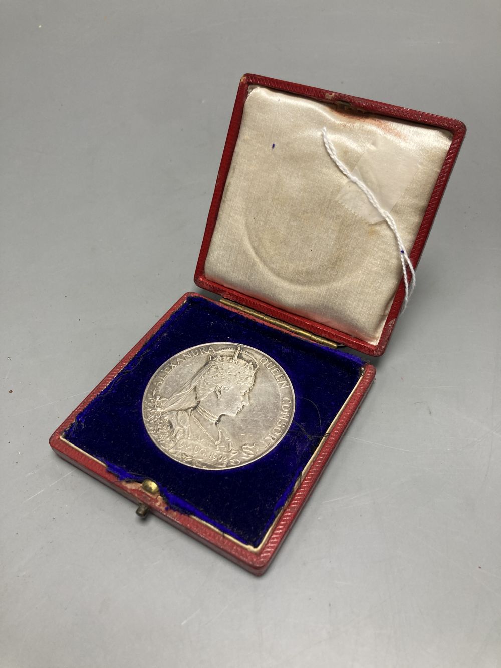 An Edward VII coronation medallion by George William DeSaulle, 55mm, 86g, uncased, GVF